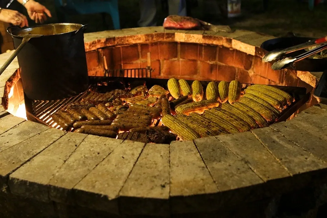 A grill with many different types of food on it.
