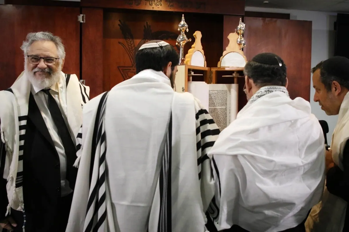 A group of men in white and black robes.
